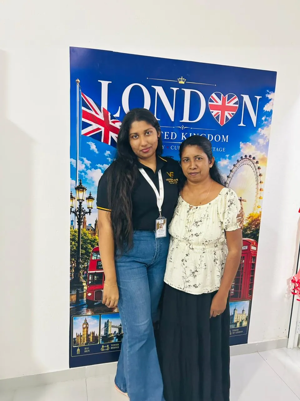 Victoria Eye staff with a client at the London wall